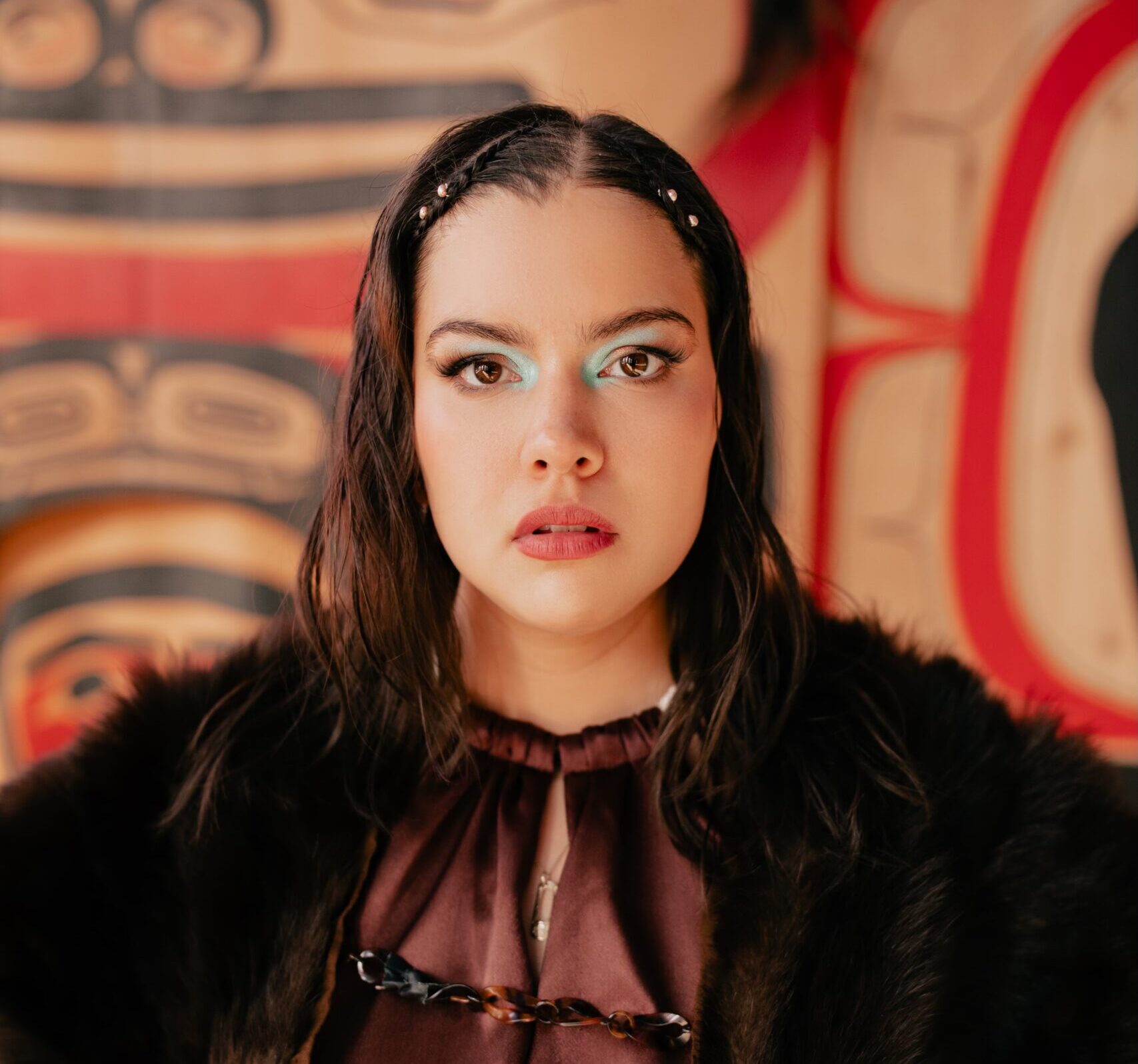 Five people standing in front of mountains